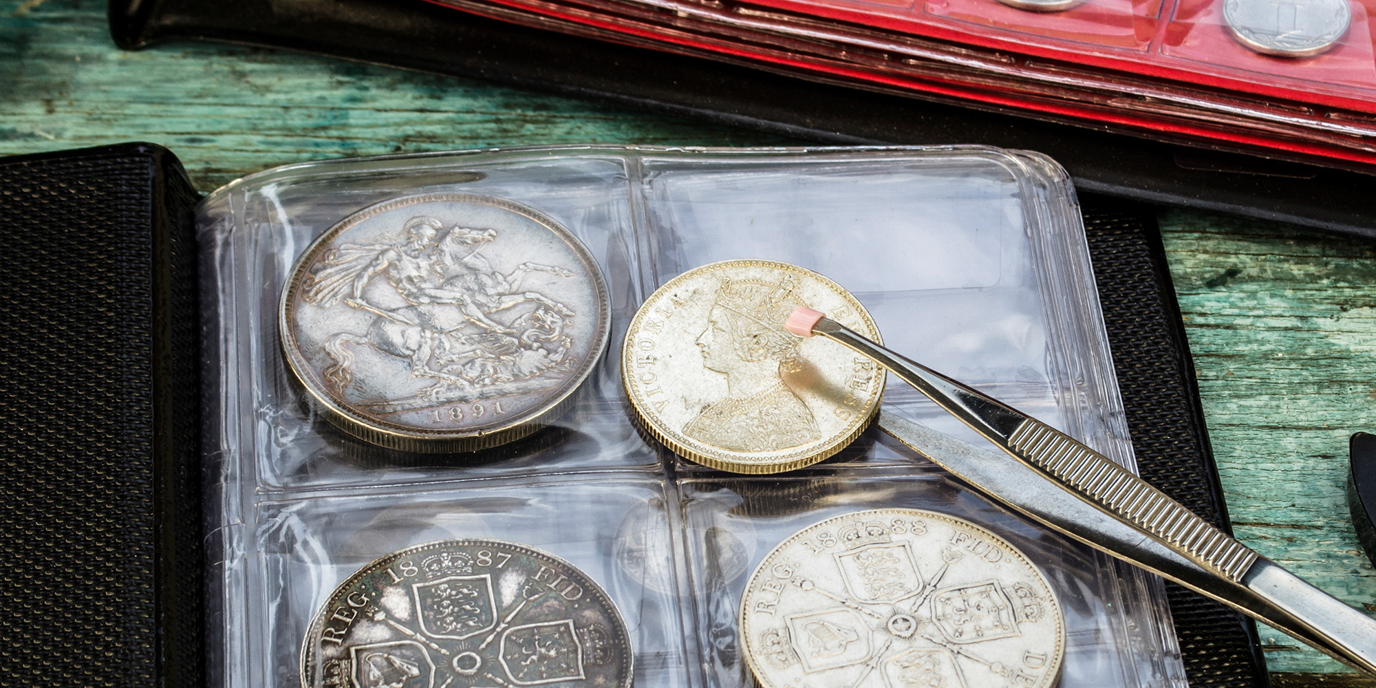 Image of silver coins in a collectors book