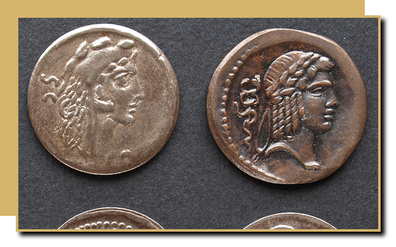 Roman coins on display against a dark backdrop