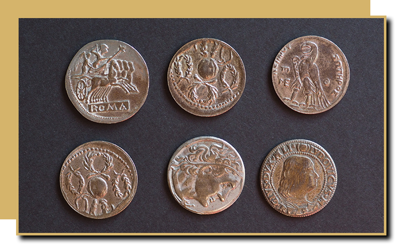 An image of 6 coins on display