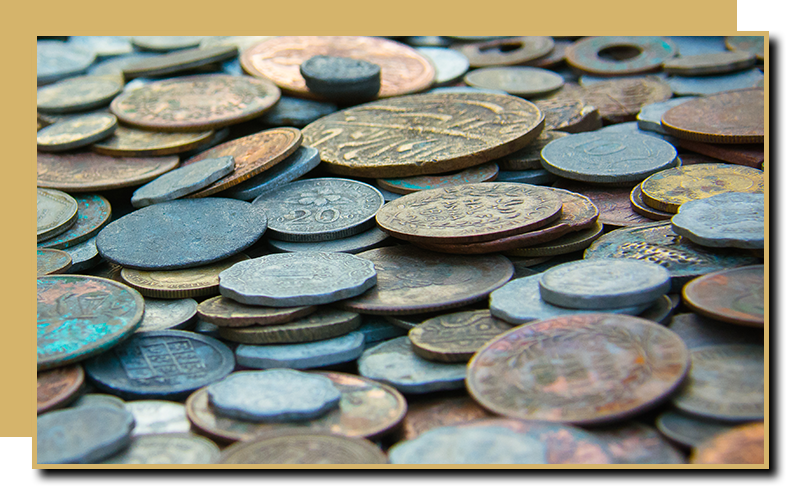 a large pile of old coins in a variety of conditions